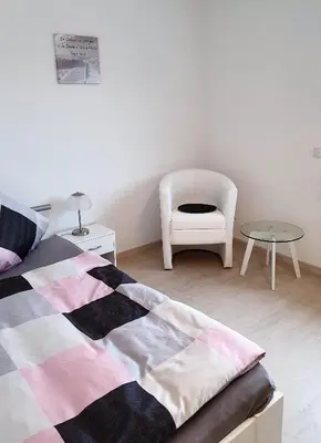 Ein Bett oder Betten in einem Zimmer der Unterkunft Pension Nickel Ferienwohnung II Waldstraße 18 Alsbach-Hähnlein