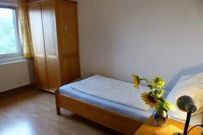 Ein Bett oder Betten in einem Zimmer der Unterkunft Pension Schreckhof