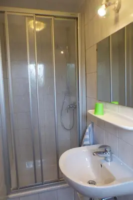 Ein Badezimmer in der Unterkunft Pension Schreckhof
