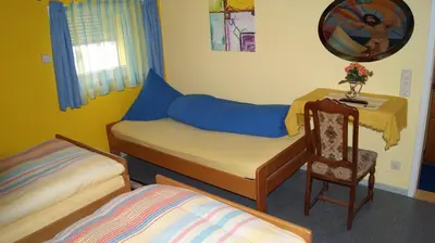 Ein Bett oder Betten in einem Zimmer der Unterkunft Pension Weinsberg