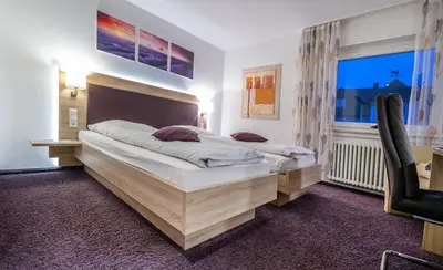 Ein Bett oder Betten in einem Zimmer der Unterkunft Hotel Villa Sulmana