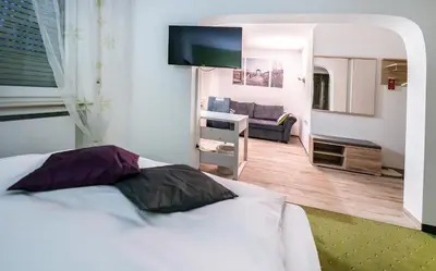 Ein Bett oder Betten in einem Zimmer der Unterkunft Hotel Villa Sulmana