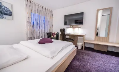 Ein Bett oder Betten in einem Zimmer der Unterkunft Hotel Villa Sulmana