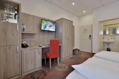 Ein Bett oder Betten in einem Zimmer der Unterkunft Hotel Engelhorn