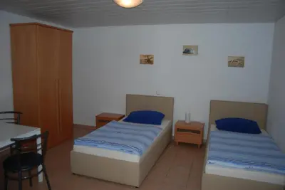 Ein Bett oder Betten in einem Zimmer der Unterkunft Ferienwohnungen Schäfer