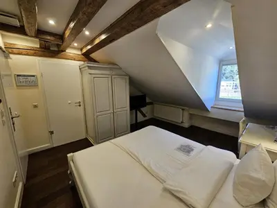 Ein Bett oder Betten in einem Zimmer der Unterkunft Hotel Villa Marstall