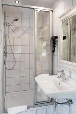 Ein Badezimmer in der Unterkunft Hotel Villa Marstall