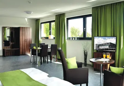 Ein Sitzbereich in der Unterkunft Motel am Fürfelder Schloss