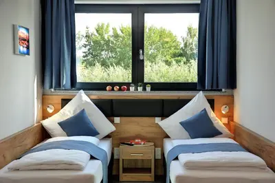 Ein Bett oder Betten in einem Zimmer der Unterkunft Motel am Fürfelder Schloss
