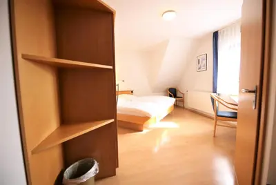 Ein Bett oder Betten in einem Zimmer der Unterkunft Gasthof Lamm