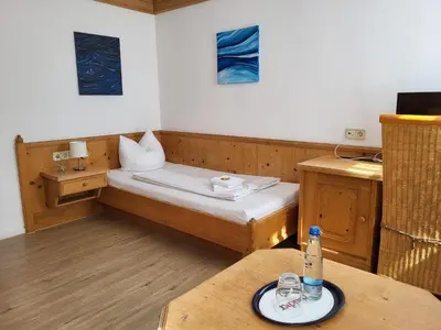 Ein Bett oder Betten in einem Zimmer der Unterkunft Historikhotel Ochsen