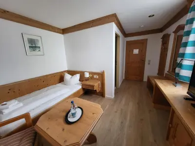 Ein Bett oder Betten in einem Zimmer der Unterkunft Historikhotel Ochsen