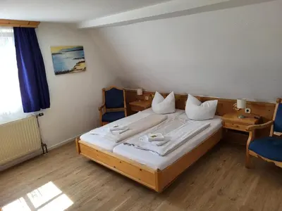 Ein Bett oder Betten in einem Zimmer der Unterkunft Historikhotel Ochsen