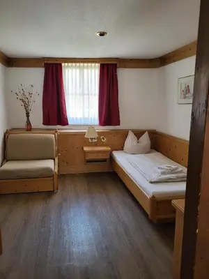 Ein Bett oder Betten in einem Zimmer der Unterkunft Historikhotel Ochsen