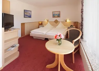 Ein Bett oder Betten in einem Zimmer der Unterkunft Hotel Phönix