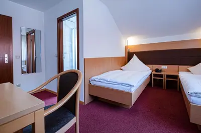 Ein Bett oder Betten in einem Zimmer der Unterkunft Hotel Phönix
