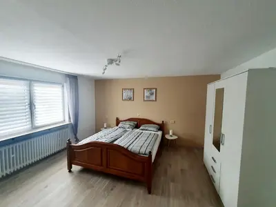 Ein Bett oder Betten in einem Zimmer der Unterkunft Ferienwohnung Baumann