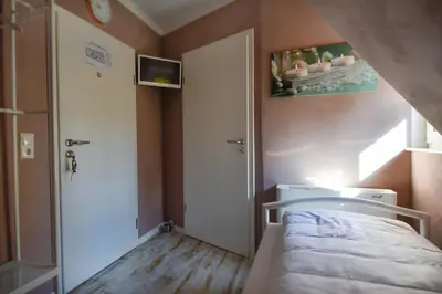 Ein Bett oder Betten in einem Zimmer der Unterkunft Historia Hotel