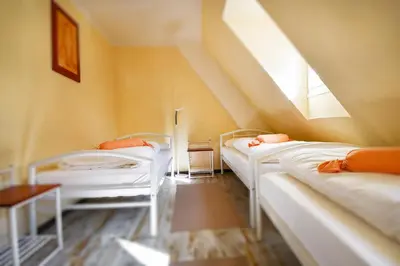 Ein Bett oder Betten in einem Zimmer der Unterkunft Historia Hotel