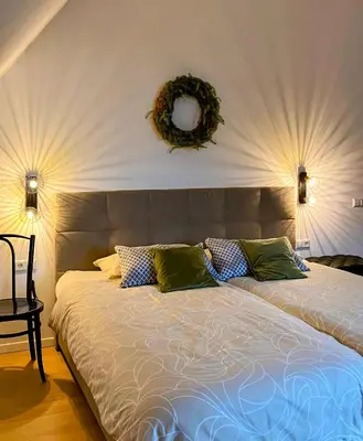 Ein Bett oder Betten in einem Zimmer der Unterkunft Boutique Apartments & Café am Sonnenhof 1737