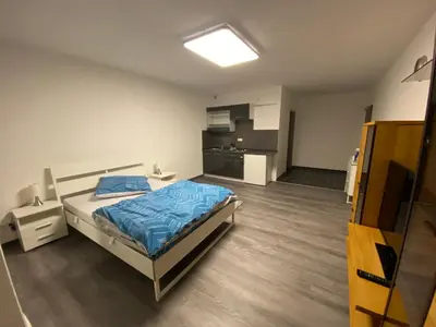 Ein Bett oder Betten in einem Zimmer der Unterkunft Pension Neon