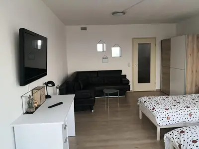 Ein Bett oder Betten in einem Zimmer der Unterkunft Über den Wolken und super zentral zwischen Frankfurt und Darmstadt - 100qm