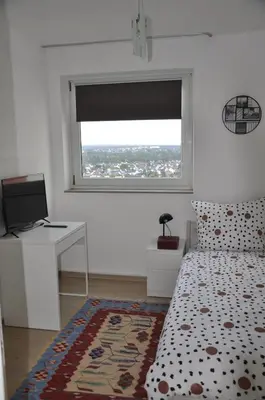 Ein Bett oder Betten in einem Zimmer der Unterkunft Über den Wolken und super zentral zwischen Frankfurt und Darmstadt - 100qm