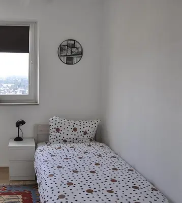 Ein Bett oder Betten in einem Zimmer der Unterkunft Über den Wolken und super zentral zwischen Frankfurt und Darmstadt - 100qm