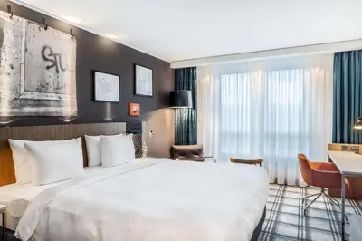 Ein Bett oder Betten in einem Zimmer der Unterkunft Radisson Blu Hotel Karlsruhe
