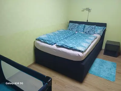 Ein Bett oder Betten in einem Zimmer der Unterkunft Ferienwohnung in dem schönen Kurort Bad Dürkheim