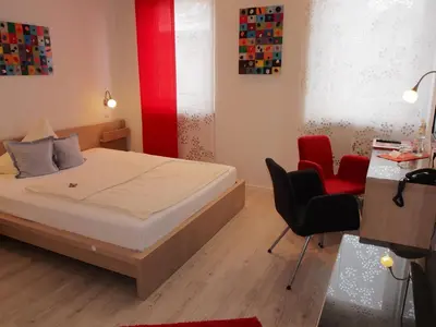 Ein Bett oder Betten in einem Zimmer der Unterkunft Hotel Barbarossa Karlsruhe Stadtmitte