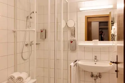 Ein Badezimmer in der Unterkunft Hotel Die Kleine Blume