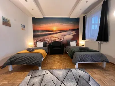 Ein Bett oder Betten in einem Zimmer der Unterkunft Grosses Apartment Aschaffenburg 4 Schlafzimmer für bis zu 11 Gäste AschaffApartment Mainaschaff