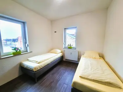 Ein Bett oder Betten in einem Zimmer der Unterkunft Business Apartments Großostheim