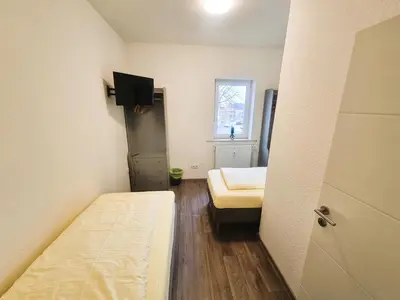 Ein Bett oder Betten in einem Zimmer der Unterkunft Business Apartments Großostheim