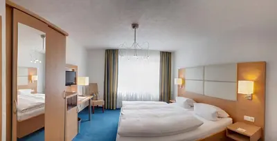Ein Bett oder Betten in einem Zimmer der Unterkunft Hotel-Restaurant Haus Nicklass