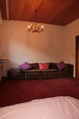 Ein Bett oder Betten in einem Zimmer der Unterkunft E Kurhaus Wohnung Nr 5