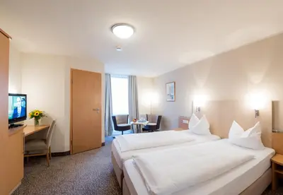 Ein Bett oder Betten in einem Zimmer der Unterkunft Amtsstüble Hotel & Restaurant