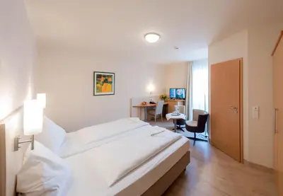 Ein Bett oder Betten in einem Zimmer der Unterkunft Amtsstüble Hotel & Restaurant