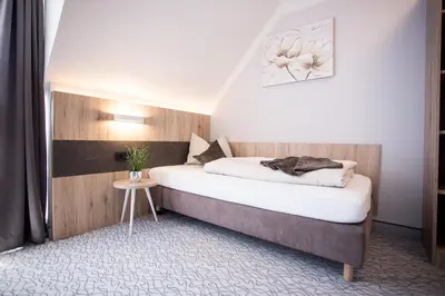 Ein Bett oder Betten in einem Zimmer der Unterkunft Amtsstüble Hotel & Restaurant