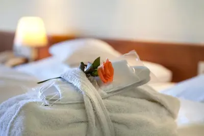 Ein Bett oder Betten in einem Zimmer der Unterkunft Hotel am Rosengarten