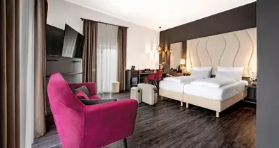 Ein Bett oder Betten in einem Zimmer der Unterkunft PLAZA INN Heilbronn