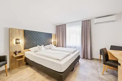 Ein Bett oder Betten in einem Zimmer der Unterkunft Best Western Hotel Favorit