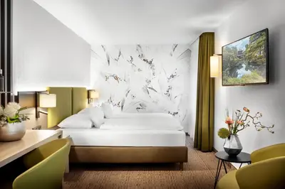 Ein Bett oder Betten in einem Zimmer der Unterkunft Best Western Hotel Favorit