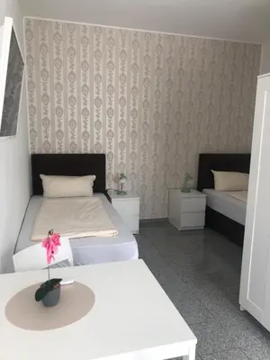 Ein Bett oder Betten in einem Zimmer der Unterkunft Hotel Restaurant Artemis