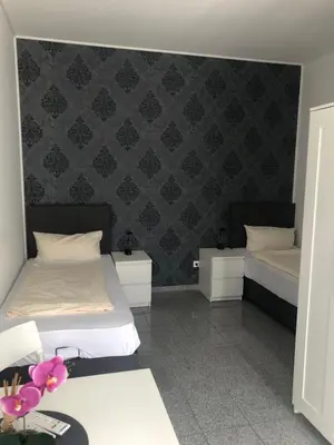 Ein Bett oder Betten in einem Zimmer der Unterkunft Hotel Restaurant Artemis