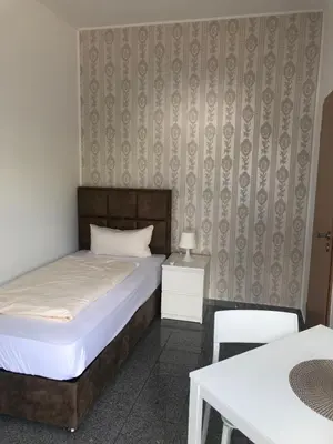 Ein Bett oder Betten in einem Zimmer der Unterkunft Hotel Restaurant Artemis