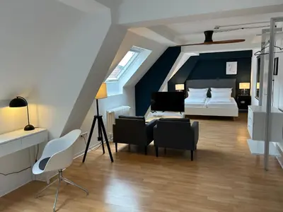 Ein Bett oder Betten in einem Zimmer der Unterkunft DK Hotel Heidelberg