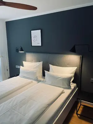 Ein Bett oder Betten in einem Zimmer der Unterkunft DK Hotel Heidelberg