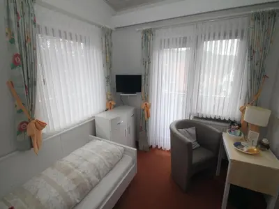 Ein Bett oder Betten in einem Zimmer der Unterkunft Hotel Irene